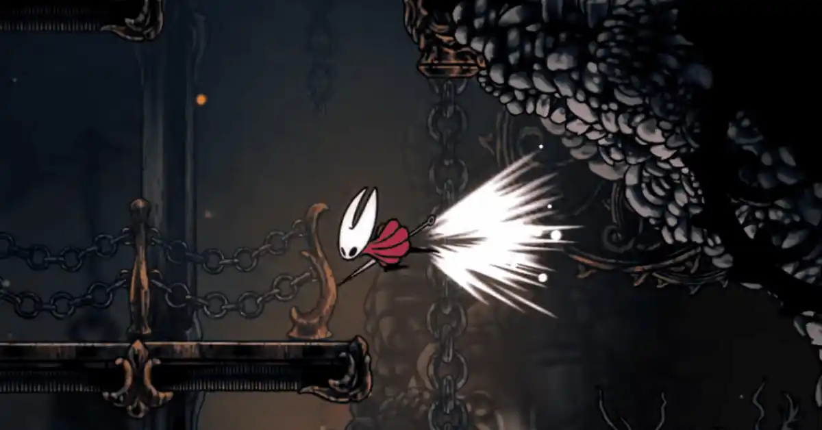 Hornet scatta attraverso la città dorata di Pharloom in Hollow Knight: Silksong.