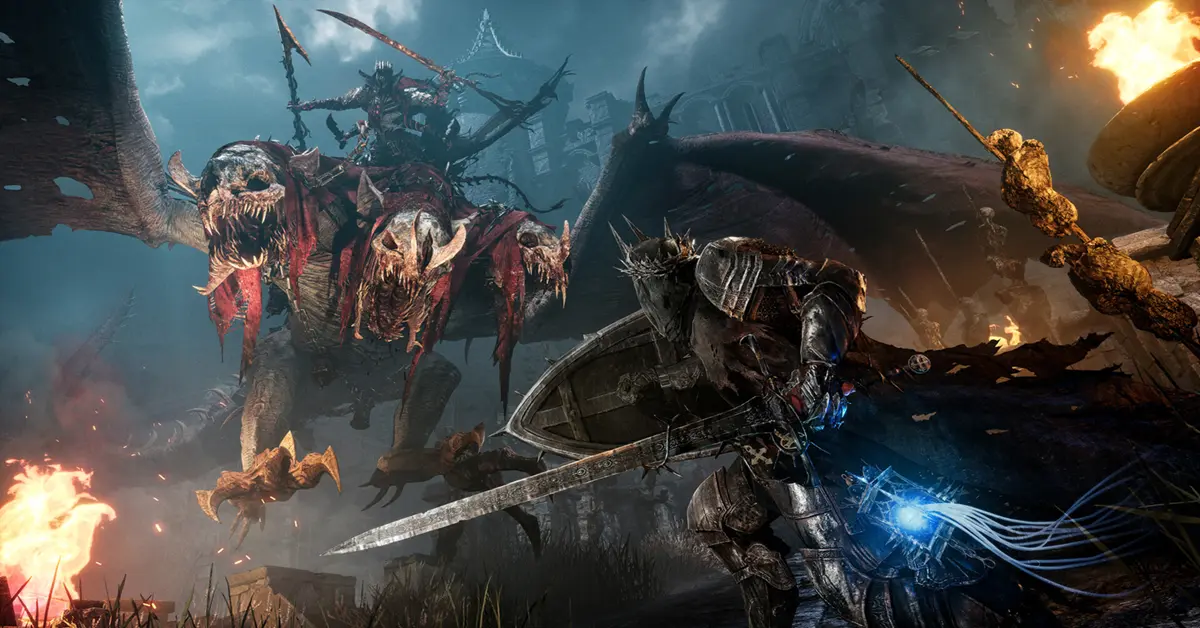 Protagonista di Lords of the Fallen con una lanterna in un ambiente dark fantasy.
